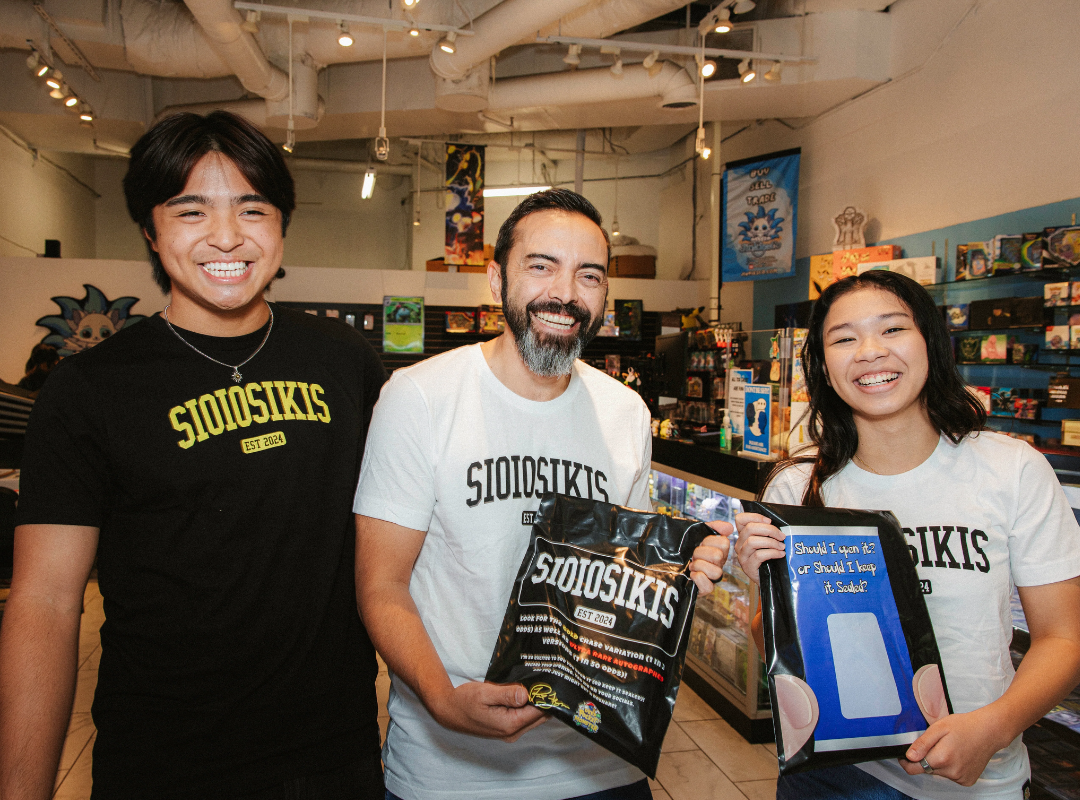 Deep Pocket Monster brand photo with three people holding merchandise