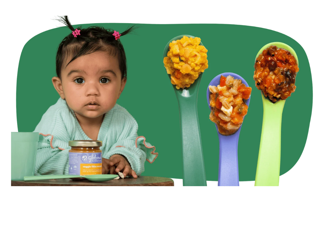 Globowl baby food with a child and colorful spoons of food